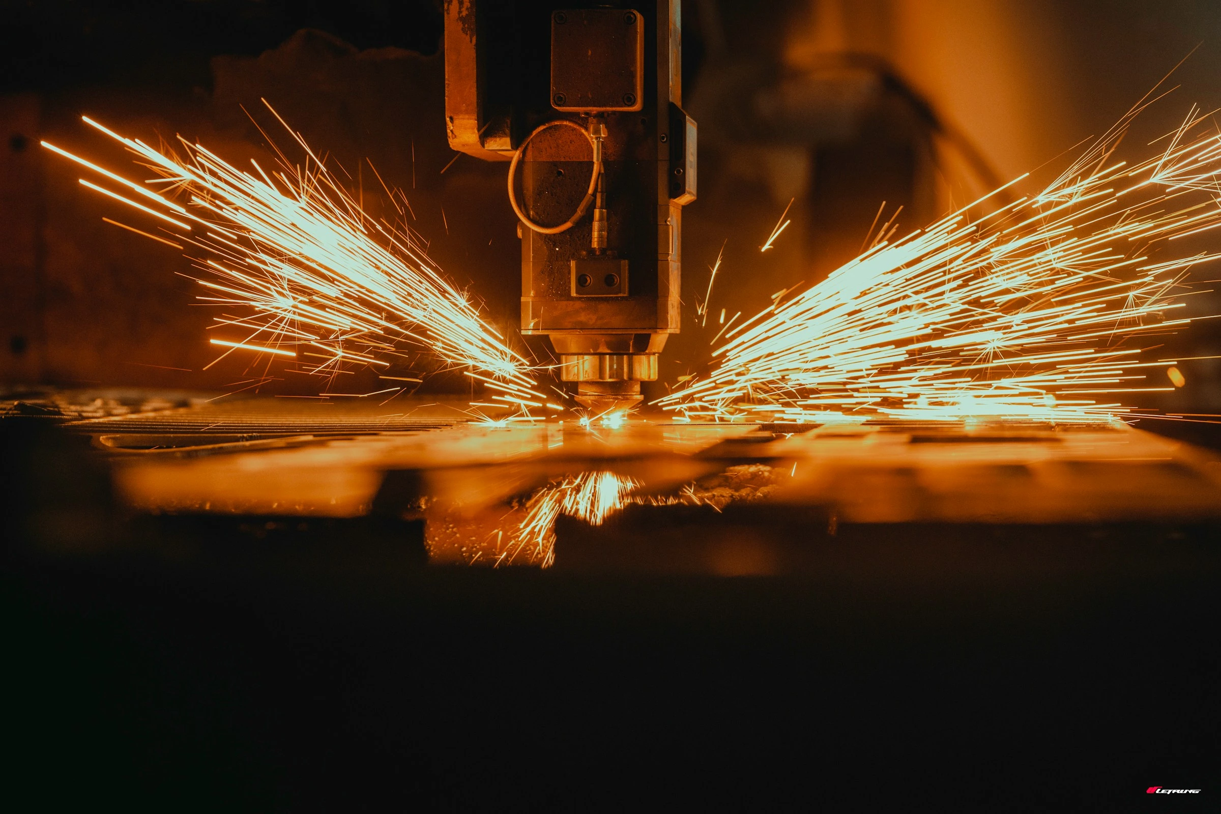 Laser cutting sparks close-up